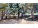 Backyard with wooden fence and mature shade trees defining property line at 625 Compton Ln, Mcdonough, GA 30253