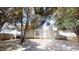 View of the home's backyard featuring a lawn, exterior siding, trees, and a wooden fence at 625 Compton Ln, Mcdonough, GA 30253