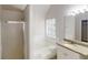 A stylish bathroom featuring a shower, tub, vanity with granite countertop, and window at 625 Compton Ln, Mcdonough, GA 30253