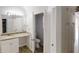 A modern bathroom is shown, with a granite vanity, tile floor, and toilet in a separate room at 625 Compton Ln, Mcdonough, GA 30253