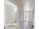 Well-lit bathroom featuring a granite countertop vanity, toilet and access to the entrance foyer at 625 Compton Ln, Mcdonough, GA 30253