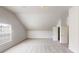 Open bedroom featuring carpet, window, closet, and pitched ceiling at 625 Compton Ln, Mcdonough, GA 30253