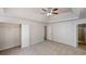 An inviting bedroom showcases a closet, fan, and neutral carpeting at 625 Compton Ln, Mcdonough, GA 30253