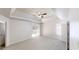 A spacious bedroom with a tray ceiling, fan, and sliding glass door to a deck at 625 Compton Ln, Mcdonough, GA 30253