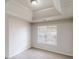 A neutral bedroom has a recessed ceiling, window, and carpet at 625 Compton Ln, Mcdonough, GA 30253