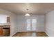 Bright dining room with tile flooring, contemporary lighting, and access to outdoor patio at 625 Compton Ln, Mcdonough, GA 30253