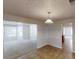 Open-concept dining room with tile flooring and view into the carpeted living room at 625 Compton Ln, Mcdonough, GA 30253