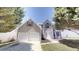 Charming two-story home with a two-car garage and well-maintained front yard at 625 Compton Ln, Mcdonough, GA 30253