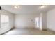 Garage with a window allowing in natural light and a door leading to the house at 625 Compton Ln, Mcdonough, GA 30253