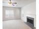 Inviting living room with neutral carpet and a modern fireplace, illuminated by natural light at 625 Compton Ln, Mcdonough, GA 30253