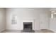 Inviting living room with a modern fireplace and large window to allow natural light at 625 Compton Ln, Mcdonough, GA 30253