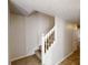 Carpeted staircase with white banister and neutral walls leading to the upper level at 625 Compton Ln, Mcdonough, GA 30253