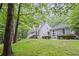 Beautiful home nestled in a lush, green landscape offering a sense of privacy and tranquility at 115 Leaf Lake Dr, Suwanee, GA 30024