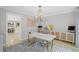 Bright home office with modern desk, stylish cabinets, and ample natural light at 115 Leaf Lake Dr, Suwanee, GA 30024