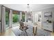Bright home office featuring a large window, a modern desk, and zebra-patterned rug at 115 Leaf Lake Dr, Suwanee, GA 30024