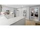 Spacious kitchen with white cabinets, marble countertops, and stainless steel appliances at 115 Leaf Lake Dr, Suwanee, GA 30024