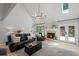 Bright living room featuring fireplace and large sliding glass doors leading to the exterior at 115 Leaf Lake Dr, Suwanee, GA 30024