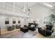 Large, bright living room showcases tall ceilings and second-floor landing, perfect for relaxing at 115 Leaf Lake Dr, Suwanee, GA 30024
