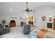 Bright and airy bedroom with TV, desk, and view into the kitchen and bathroom at 115 Leaf Lake Dr, Suwanee, GA 30024