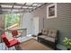 Covered patio with comfortable seating, a rug, and plants at 115 Leaf Lake Dr, Suwanee, GA 30024