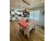 Bright and airy dining room with modern lighting and hardwood flooring at 160 Springdale Ct, Newborn, GA 30056