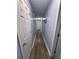 Hallway featuring several doors and wood-look flooring at 160 Springdale Ct, Newborn, GA 30056