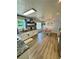 An open kitchen with white cabinets, modern appliances, and a dining area at 160 Springdale Ct, Newborn, GA 30056