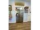 Stainless steel refrigerator in kitchen with light blue walls and decoratively displayed spices at 160 Springdale Ct, Newborn, GA 30056