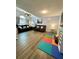 Spacious living room featuring vaulted ceiling, hardwood floors, and comfortable seating at 160 Springdale Ct, Newborn, GA 30056