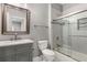 A renovated bathroom features a tub shower combo and a gray vanity with carrara top at 3699 Canyon Ridge Ne Ct, Brookhaven, GA 30319