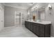 A modern bathroom features dual sinks, marble countertops, and a walk in closet at 3699 Canyon Ridge Ne Ct, Brookhaven, GA 30319