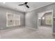 A bright bedroom featuring a ceiling fan, neutral walls, carpet and entry to a closet at 3699 Canyon Ridge Ne Ct, Brookhaven, GA 30319
