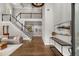 Stunning foyer with hardwood floors, staircase, two-story ceiling, and modern decor at 3699 Canyon Ridge Ne Ct, Brookhaven, GA 30319