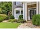 Close up view of the stone pathway leading to front door, surrounded by lush greenery at 3699 Canyon Ridge Ne Ct, Brookhaven, GA 30319