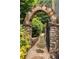 Charming stone archway entrance to a landscaped garden path at 3699 Canyon Ridge Ne Ct, Brookhaven, GA 30319