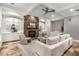 Cozy living room with stone fireplace, built-in shelving, neutral paint, and ample seating at 3699 Canyon Ridge Ne Ct, Brookhaven, GA 30319