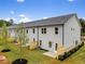 An outdoor space with small trees planted around the property, sectioned off with a fence from other homes at 5623 Hislop Ln # 84, Mableton, GA 30126