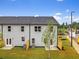 An outdoor space with small trees planted around the property, sectioned off with a fence from other homes at 5623 Hislop Ln # 84, Mableton, GA 30126