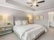 Cozy bedroom features plush carpet, ensuite bathroom access, and a ceiling fan at 5623 Hislop Ln # 84, Mableton, GA 30126