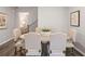 Dining room features a wooden table with upholstered chairs and modern decor at 5623 Hislop Ln # 84, Mableton, GA 30126