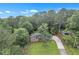 Aerial view of property showcasing house, yard, and surrounding trees at 6243 David Sw Ln, Mableton, GA 30126
