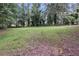 An expansive backyard, framed by mature trees, offers an abundance of outdoor space at 6243 David Sw Ln, Mableton, GA 30126