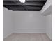 Unfinished basement bedroom featuring neutral paint, carpet and open ceiling at 6243 David Sw Ln, Mableton, GA 30126