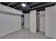 Finished basement area with gray carpet, light-colored walls, and closet at 6243 David Sw Ln, Mableton, GA 30126