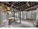 Unfinished basement featuring exposed utilities and concrete floor at 6243 David Sw Ln, Mableton, GA 30126