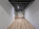 Spacious basement featuring light-colored walls and flooring, with exposed ceiling details at 6243 David Sw Ln, Mableton, GA 30126