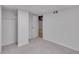 Finished basement area with gray carpet and light-colored walls, with closet at 6243 David Sw Ln, Mableton, GA 30126