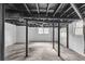 Unfinished basement space showing ductwork and utility access, neutral painted walls and concrete floor at 6243 David Sw Ln, Mableton, GA 30126