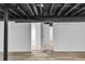 Unfinished basement offers flexible layout with painted ceilings and access to storage at 6243 David Sw Ln, Mableton, GA 30126