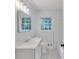Nicely updated bathroom featuring bright, natural light, tile flooring and modern fixtures at 6243 David Sw Ln, Mableton, GA 30126